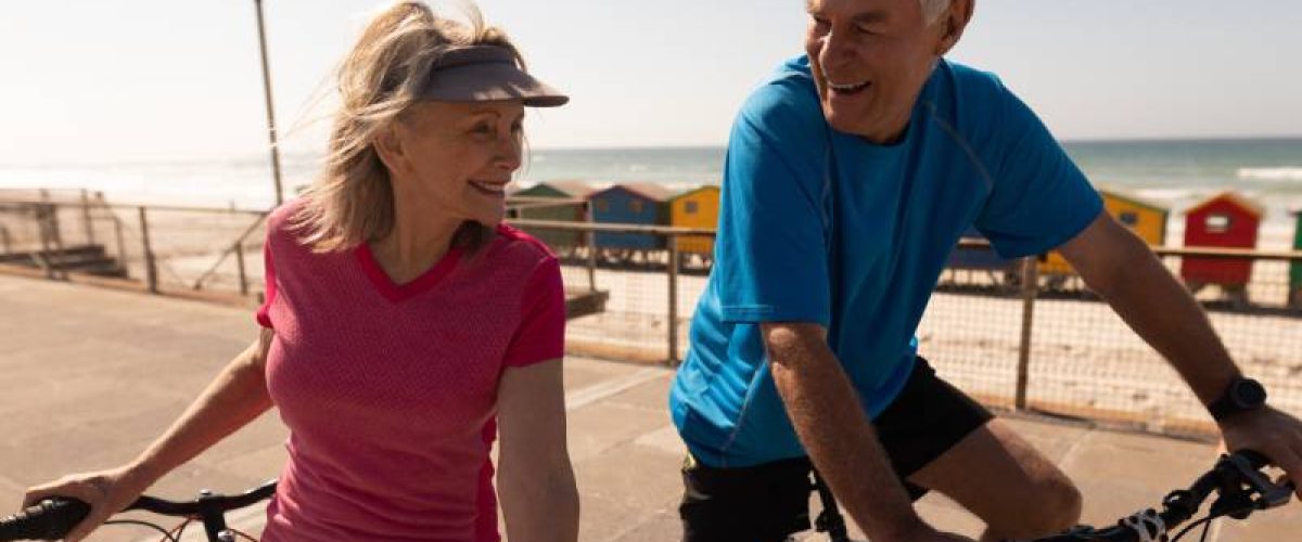 active-senior-couple-riding-a-bicycle-on-a-promena-2023-11-27-05-34-18_res