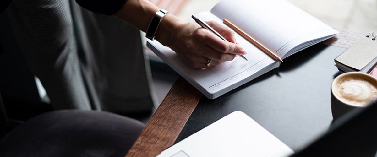 business-woman-writing-in-her-diary-2023-11-27-05-06-51-utc