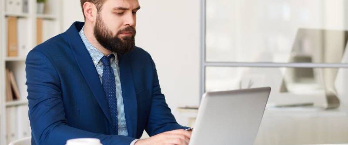 businessman-browsing-internet-2023-11-27-05-06-46-utc (1)