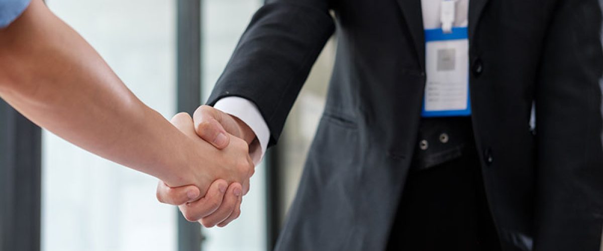 businesswoman-making-handshake-with-a-businessman-2025-01-10-11-05-11-utc_res