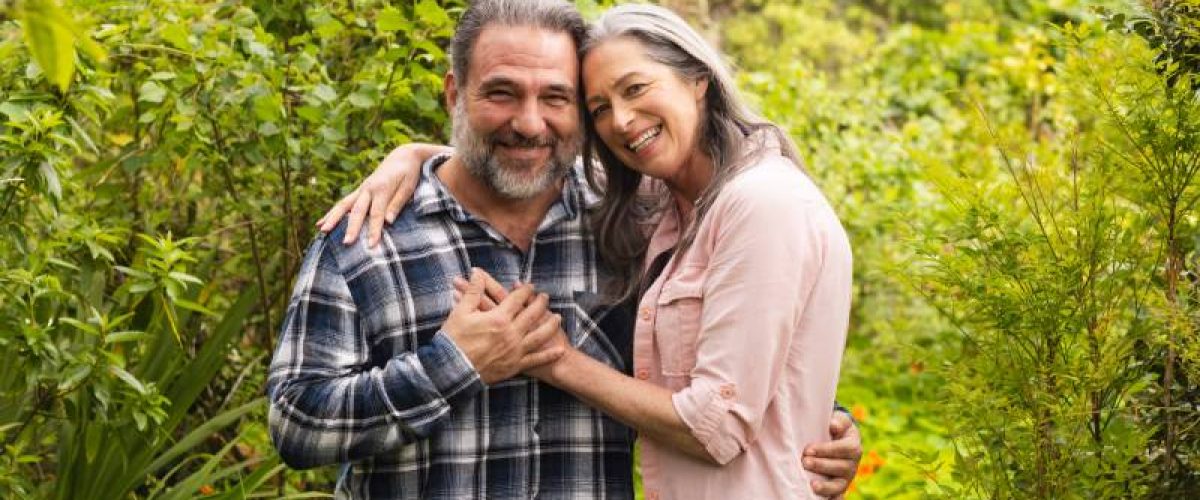 happy-mature-couple-embracing-in-lush-garden-enjo-2024-11-05-19-43-49-utc_res