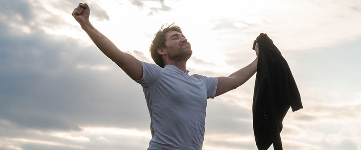 proud-young-man-standing-under-cloudy-evening-sky-2023-11-27-04-52-34-utc_res