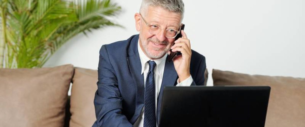 smiling-senior-businessman-talking-on-phone-2023-11-27-05-25-14-utc_resize
